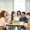photo of people looking on laptop